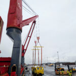 project cargo lift from rails to a charter vessel by using the vessel's crane at Hamina port in Finland