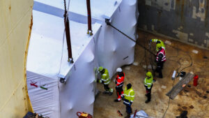 Project cargo stowage and securing inside a vessel hold during marine logistics operations.