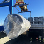 Heavy cargo unit being lifted by crane during vessel operations in Turku port, prepared for project logistics transport