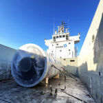 Oversized industrial cargo secured on vessel deck for project logistics transport by sea
