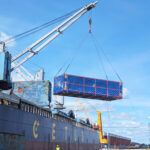 Heavy-lift operation at the Port of Hamina as project cargo is discharged from a vessel using onboard cranes.