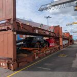 Project cargo loaded into flat rack containers at the Port of Helsinki, demonstrating secure stowage and handling of heavy industrial equipment.
