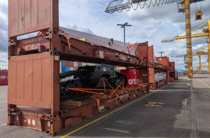 Project cargo loaded into flat rack containers at the Port of Helsinki, demonstrating secure stowage and handling of heavy industrial equipment.