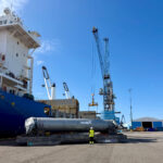 Project logistics professionals overseeing the loading of industrial process equipment at the Port of Rauma.