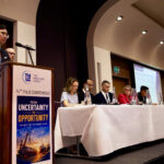 Panel discussion at a THLG conference with industry professionals sharing insights on project logistics, freight forwarding, and global supply chain developments.